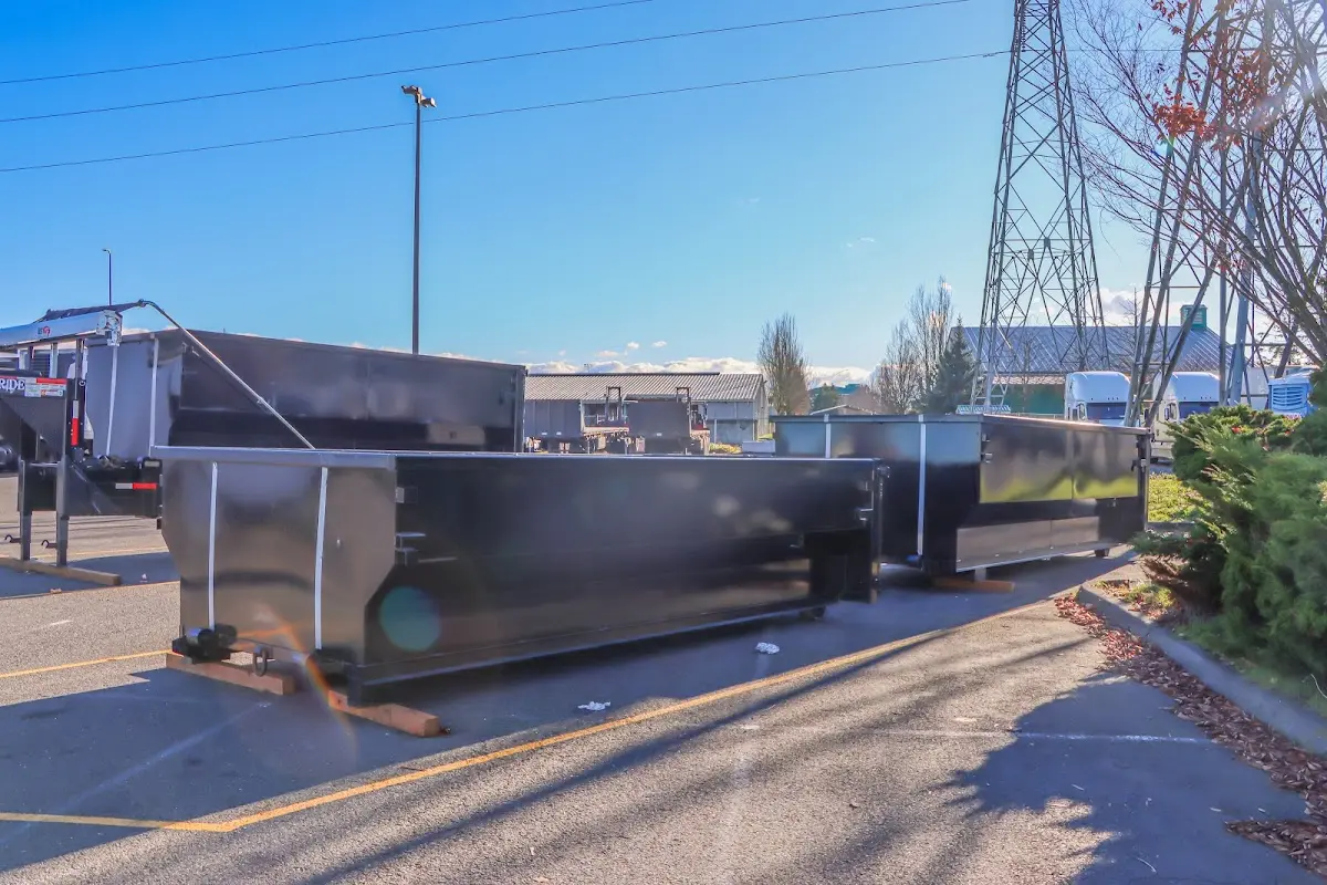 Roll-off dumpster ready for waste disposal at job site for 6 Yard Dumpster Rental in Oscoda